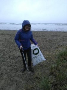 Rachelq Harman helps clean up the beach at the 2018 SOLVE Beach Cleanup